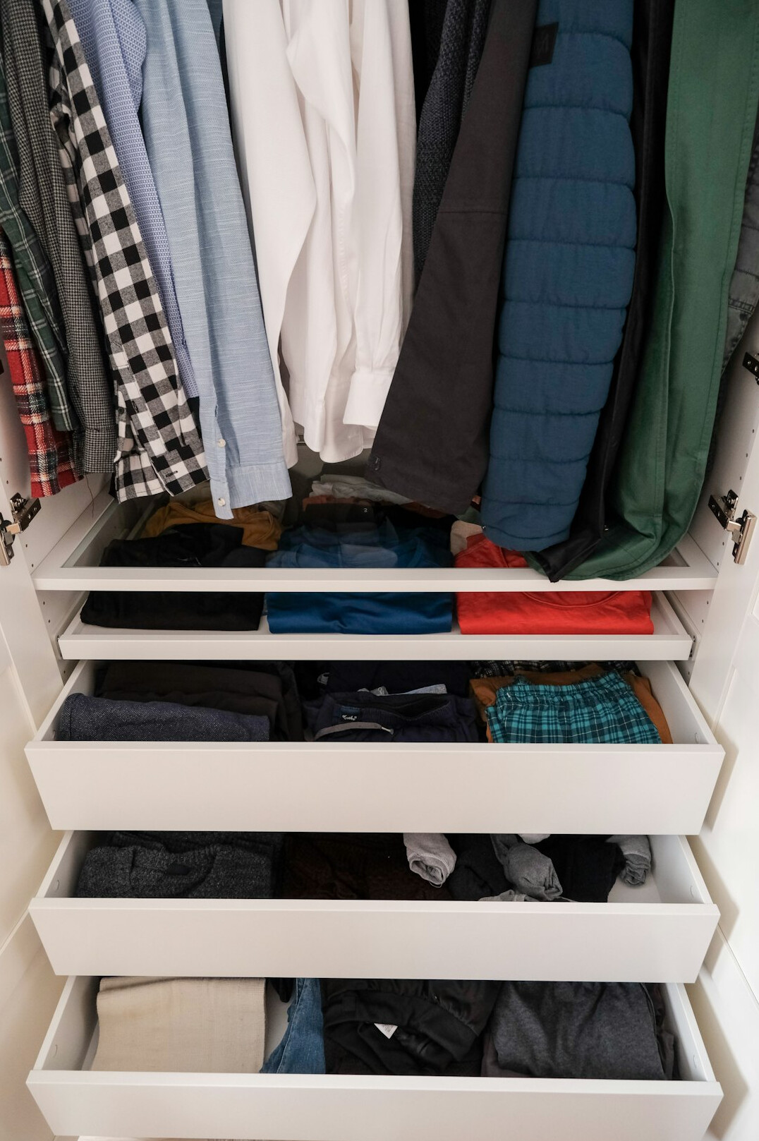 folded clothes in closet